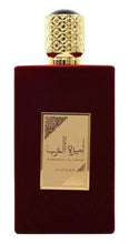 Burgundy perfume bottle with gold textured cap and centered front label