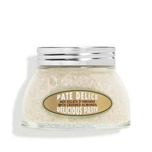 Almond body paste jar with silver lid and label on beige cream