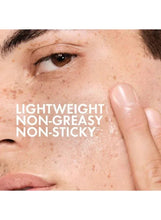 Face close-up with light, non-greasy, non-sticky cleanser texture