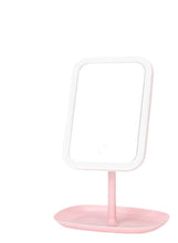 Pink LED makeup mirror with white stand and round storage tray