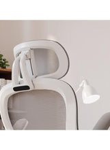 Ergonomic mesh office chair headrest with curved white frame and gray mesh back