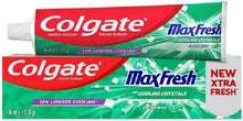 Colgate Max Fresh fluoride toothpaste tube, green label with cooling crystals and mint.