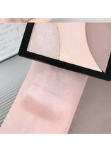Three-color contour powder swatches on skin in light contour and highlight shades