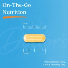 Yellow softgel capsule with size reference scale