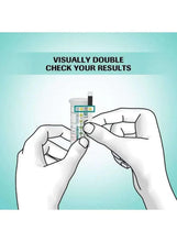 Blood glucose test strip being inserted by hands for self-testing