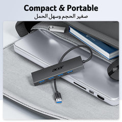 Acer powered USB splitter for PC with four USB ports shown on a laptop inside a gray bag