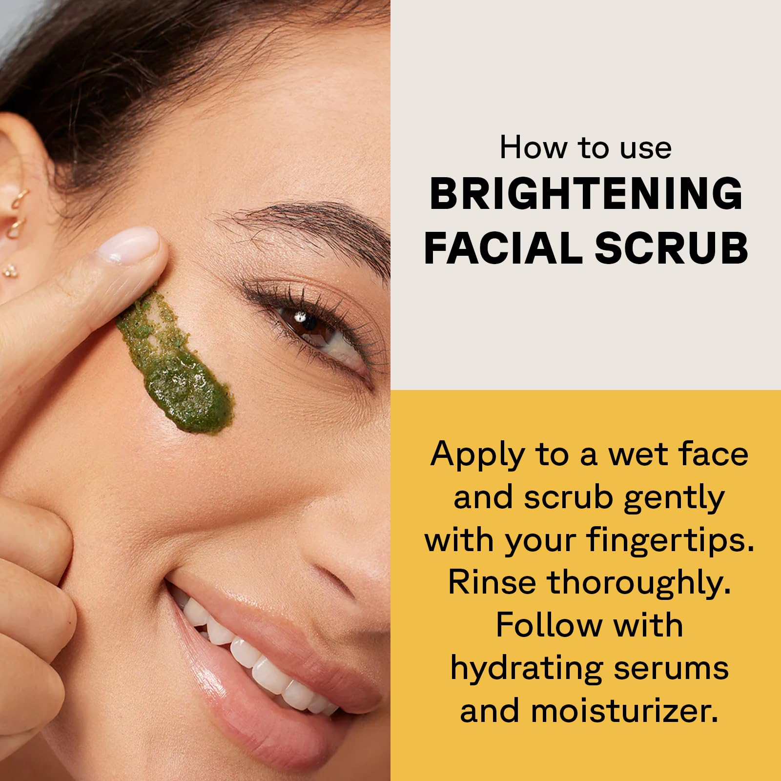 Woman applying Acure brightening facial scrub to her cheek with fingertip demonstrating usage