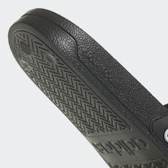 Black Adidas pool slippers for men and women with textured sole for grip and comfort