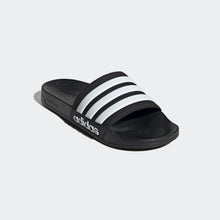 Black slide sandal with three white adidas stripes and contoured footbed