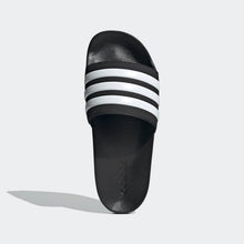 Black adidas slide sandal heel with three white stripe bands and adidas logo