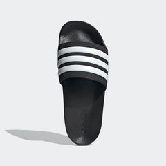 Black adidas pool slippers for men and women with white stripes and textured footbed