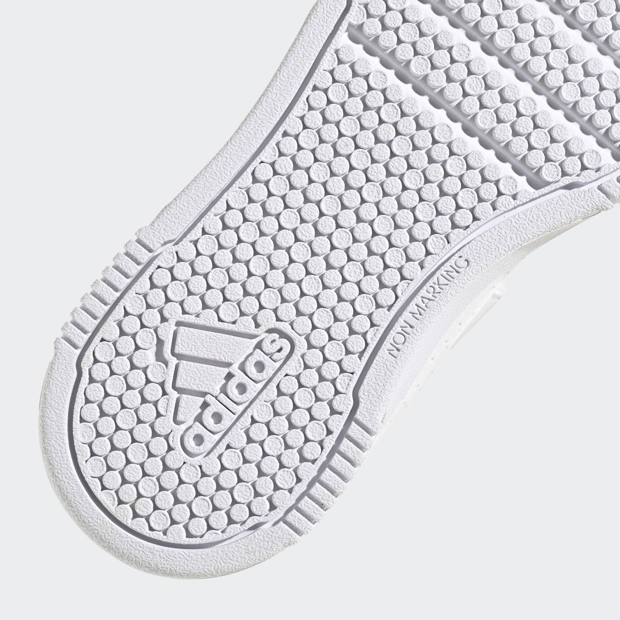 Close-up of white sole with adidas logo on adidas Tensaur Sport kids shoes showing non-marking grip