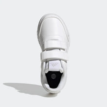 Kids adidas sneakers in white, top view of hook-and-loop strap across the opening.