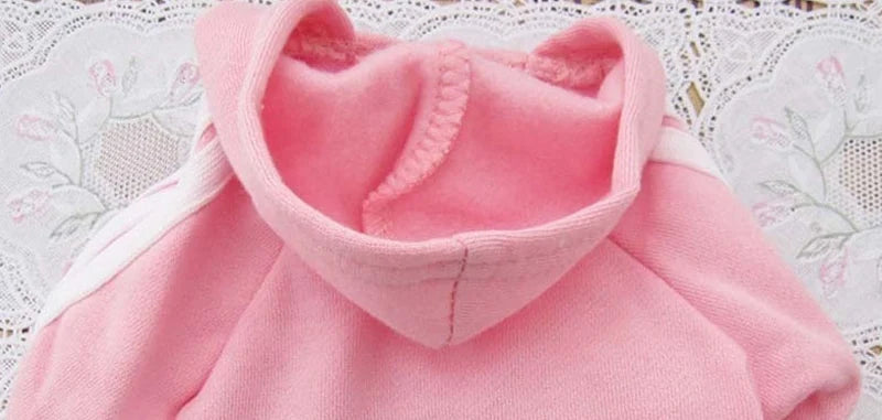 Pink Adidog dog hoodie featuring a cozy hood and soft fabric for warm and stylish pet wear