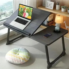 Gray portable laptop desk with angled tabletop and side platform for accessories