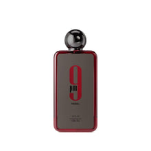 Perfume bottle with glossy black cap and red glass body, front view