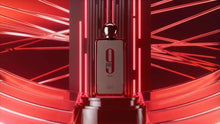 Tall perfume bottle with black cap and red glass body