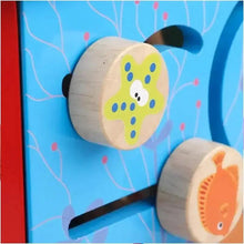 Wooden activity cube side knob with dog illustration on blue panel