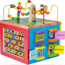 Wooden activity cube with letter board and doctor, baker, mailman play stations