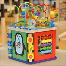 Colorful wooden activity cube with penguin clock panel and bead counting window