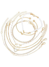 Gold-tone bracelet set with pearl-bead and chain-link cuffs, multiple bracelets