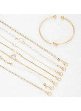 Gold-tone chain bracelets with lobster clasps and a thin open bangle
