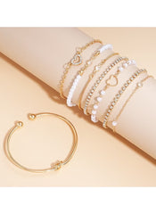 Huitich 8 piece alloy bracelet set featuring gold and white beaded designs with heart charms