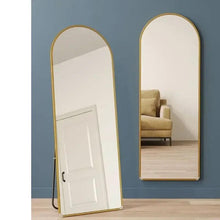 Gold arched mirror with metal frame, rear stand and reflective glass