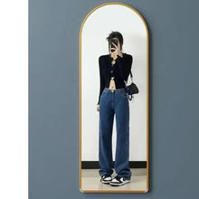 Gold arched full-length mirror with metal frame, wall mount-ready
