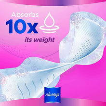 Winged sanitary pad with raised textured surface, shown extended