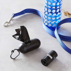 Amazon Basics dog poop bags with dispenser and water bottle on a stylish pet leash