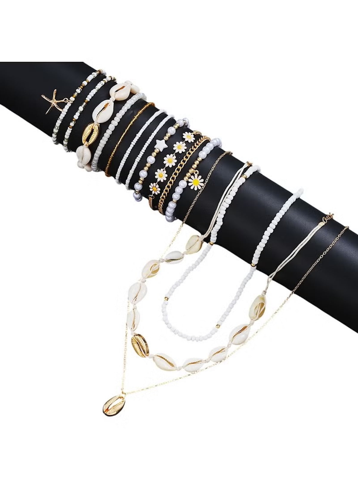 Huitich 14 piece layered beach jewelry with shells, beads, and gold accents on black display