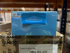 Blue packaging box of 2K webcam for laptop from the Anker Store placed on a branded Anker shipping box