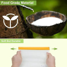 Clear snack storage bag with orange zip top, held by two hands over a coconut