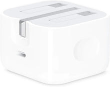 White fast charging USB plug adapter, side view of prongs and vented top