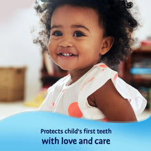 Baby using milk teeth toothpaste with love and care