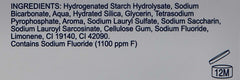 Close up ingredients label for Arm & Hammer Advance White toothpaste listing sodium fluoride and 12M icon
