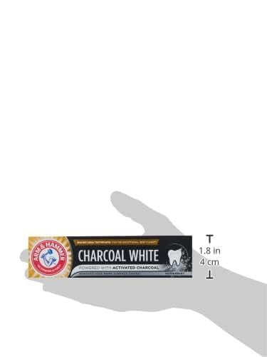 ARM & HAMMER charcoal white toothpaste box held in hand showing activated charcoal whitening