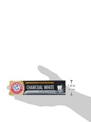 ARM & HAMMER charcoal white toothpaste box held in hand showing activated charcoal whitening