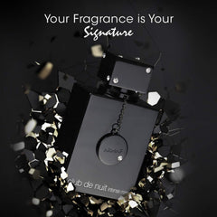 Armaf Club de Nuit Intense Man black perfume bottle with decorative gems surrounded by shattered black glass