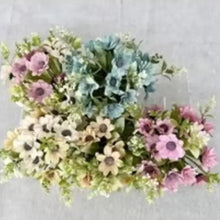 Artificial mixed flower bonsai with blue, pink, and yellow blossoms in white pots