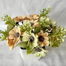 Artificial flower bonsai decor in white pot with cream, tan blooms and green leaves