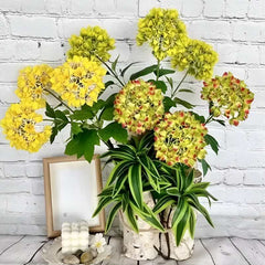 Huitich artificial flower decor for home with yellow and green flowers in white pots on a wooden surface