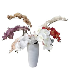 Huitich artificial flower decor pack with colorful orchid stems arranged in a white textured vase