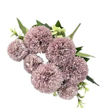Artificial fluffy rose bouquet with dusty rose pom-pom flowers and green leaves