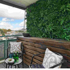 Huitich artificial grass wall backdrop installed on balcony with wooden bench and chairs