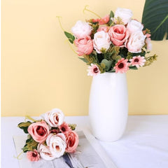 Huitich artificial mini rose flowers bouquet with pink and white blooms in a white vase and lying on a table