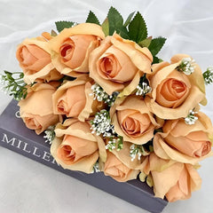 Huitich artificial orange flower arrangement featuring realistic orange roses with green leaves and white filler flowers