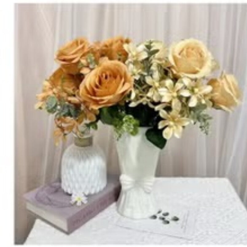 Huitich artificial orange flower decor arranged in white vases on a table with a book and curtain background