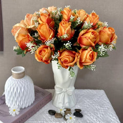 Huitich artificial orange roses for wedding in white vase with greenery and small white flowers